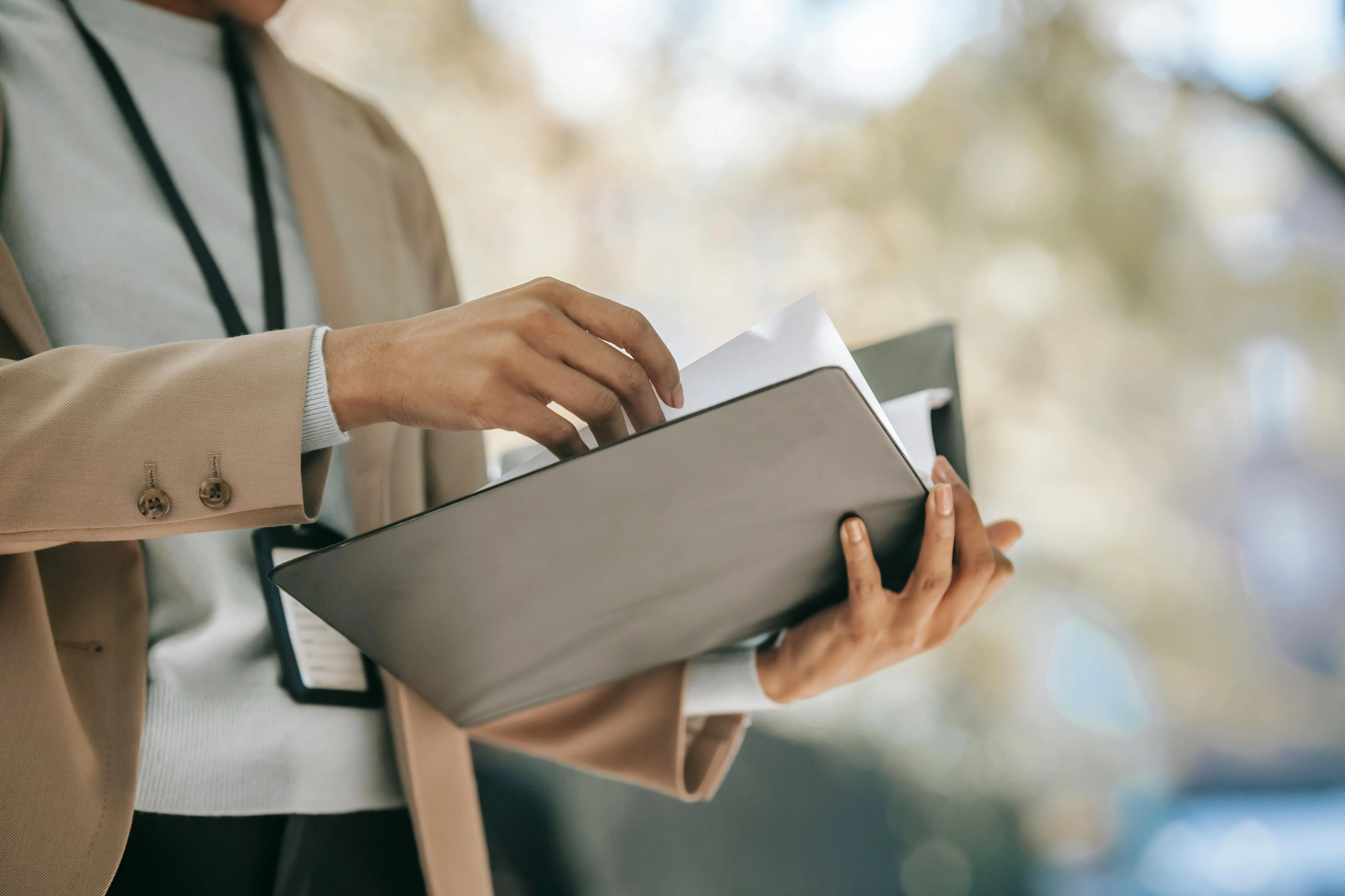 A Person holding a notebook.